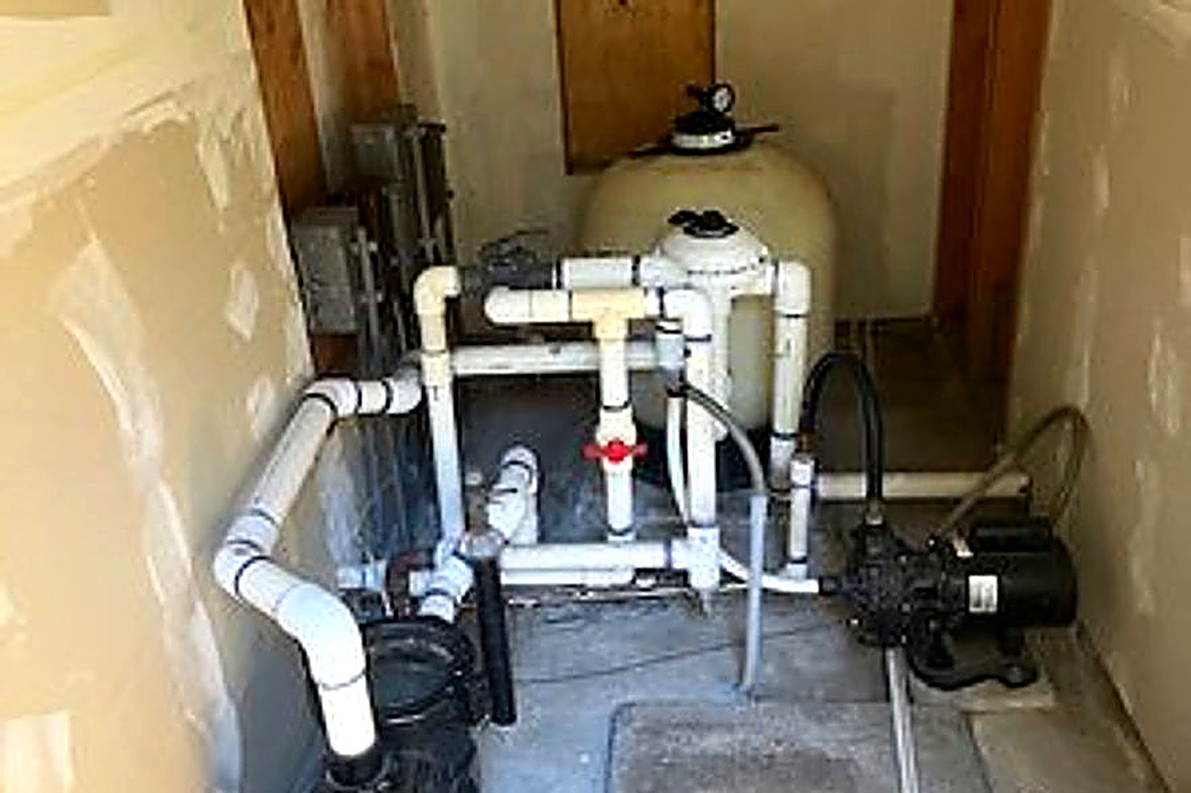 Pool equipment pad with pump, filter and plumbing serviced by A&Z Pool Service